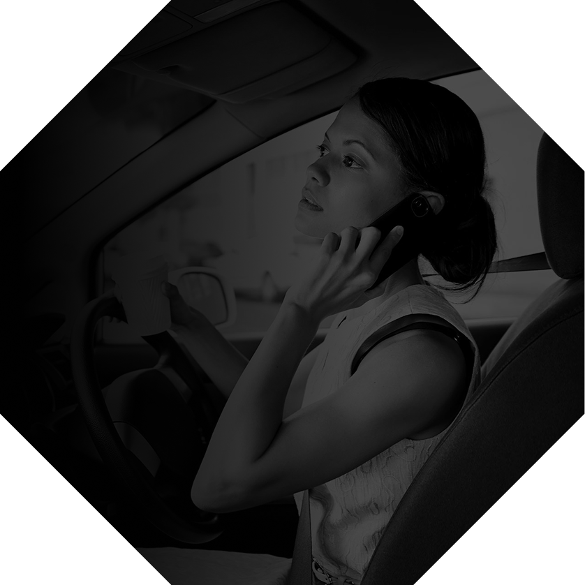 A driver taking their mind off driving, illustrating cognitive distraction.