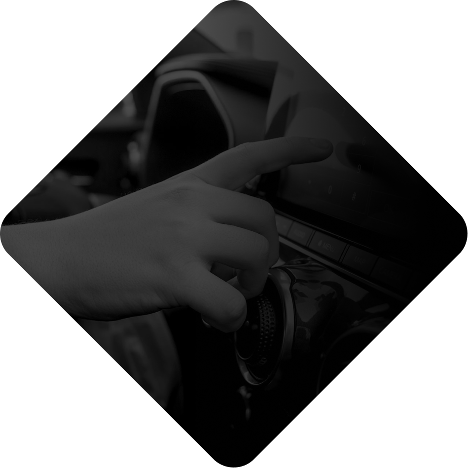 A driver taking their hands off the wheel, illustrating manual distraction.