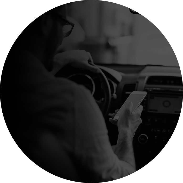 A driver taking their eyes off the road, illustrating visual distraction.